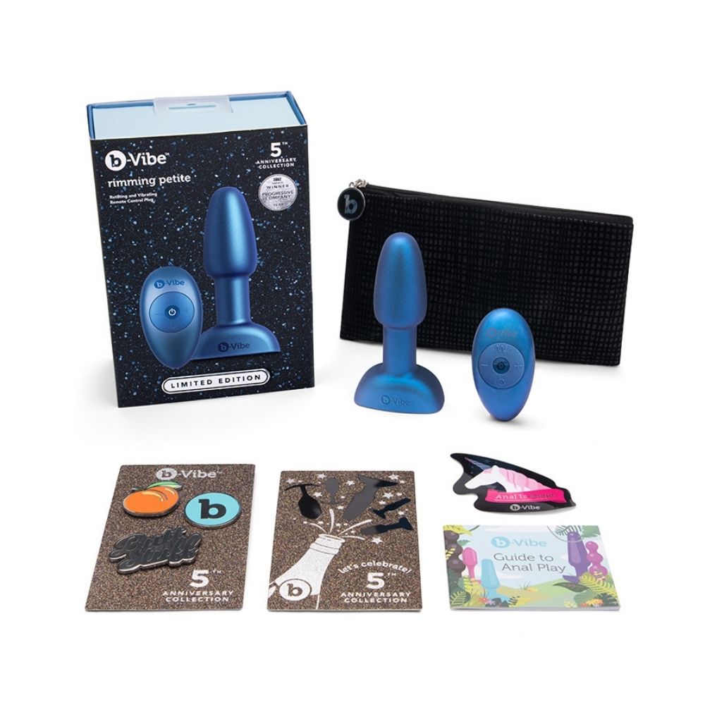 The contents of the B-Vibe Rimming Petite Plug - Limited Edition Night Sky box, including the plug, remote, travel bag, pins and user guide