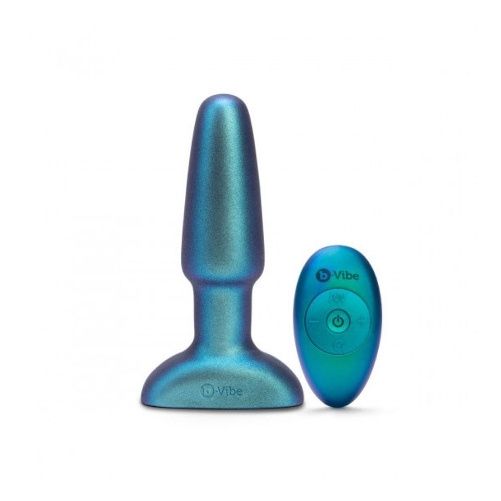 B-Vibe Rimming Plug 2 - Limited Edition Space Green standing upright on base beside the remote control it comes with