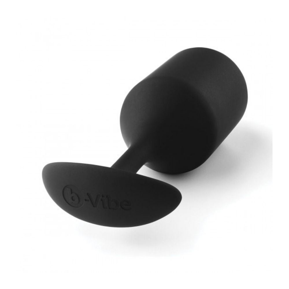 B-Vibe Snug Plug XL laying flat on side with its base in the forefront
