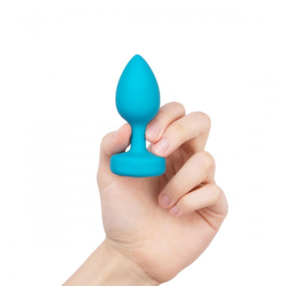 Aqua B-Vibe Vibrating Jewel Plug Small/Medium being held in hand