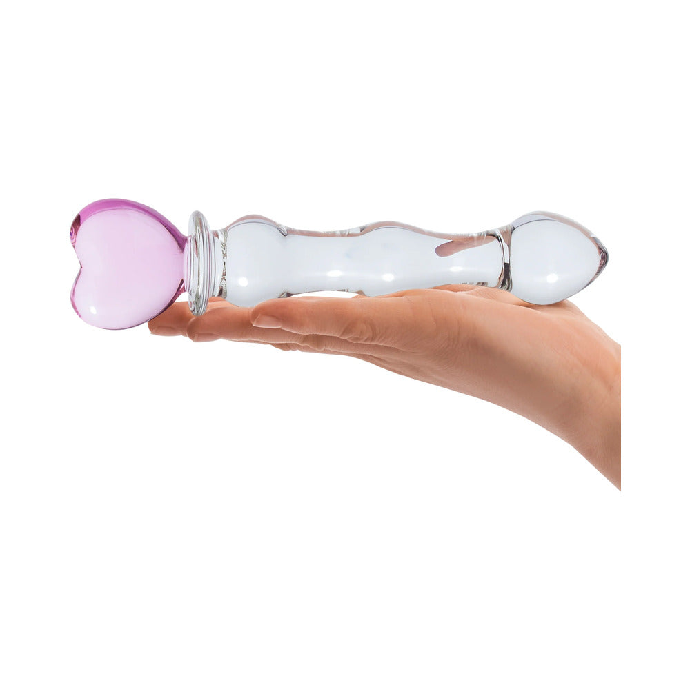 Glas8in.GlassDildowithHeartHandlerestingonahand