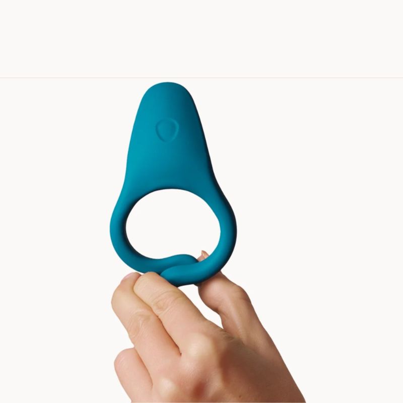 hand holding Dame Hug Vibrating Ring Fir