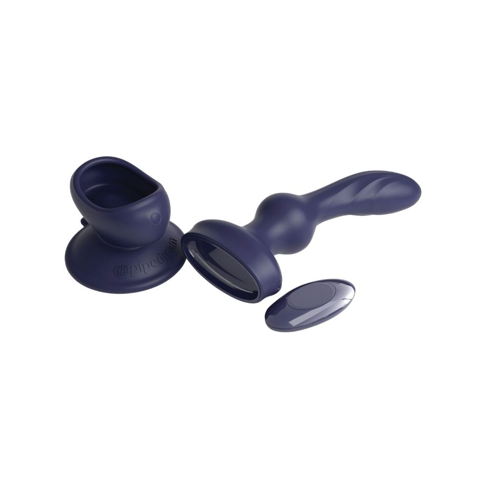 3Some P-Spot Wall Banger laying flat beside the suction cup base and remote it comes with