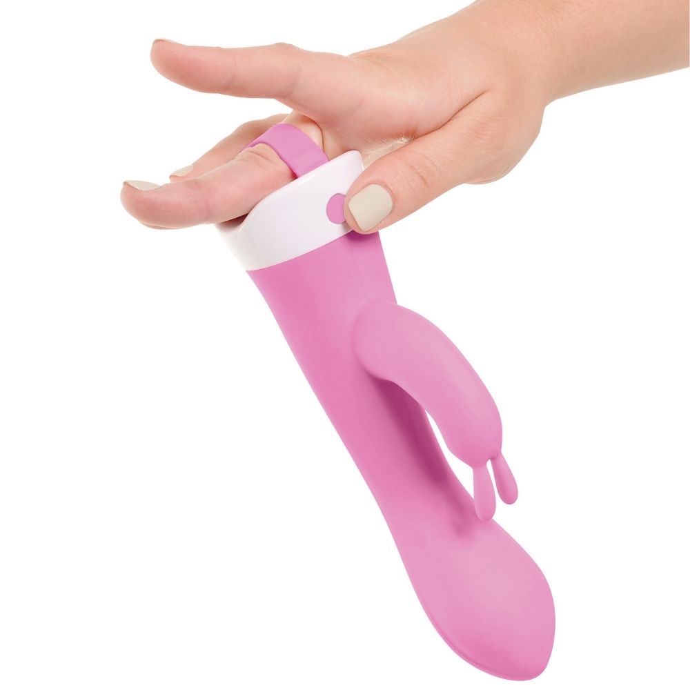 3Some Wall Banger Rabbit being held by finger-loop located on the base of the toy  