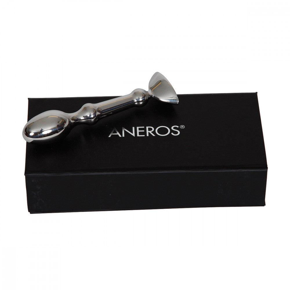 Aneros Tempo laying flat on top of the black box it comes with