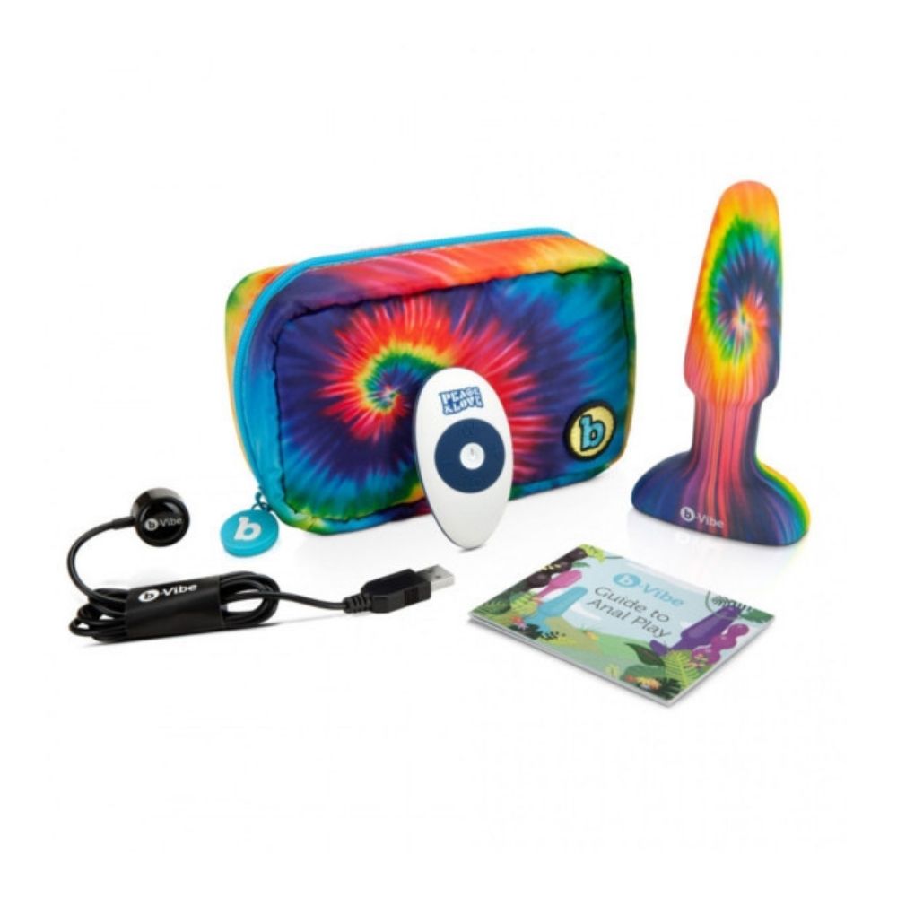 B-Vibe Peace & Love Tie Dye Rimming Plug contents of the box, including the plug, remote, charging cable, travel bag, and user guide