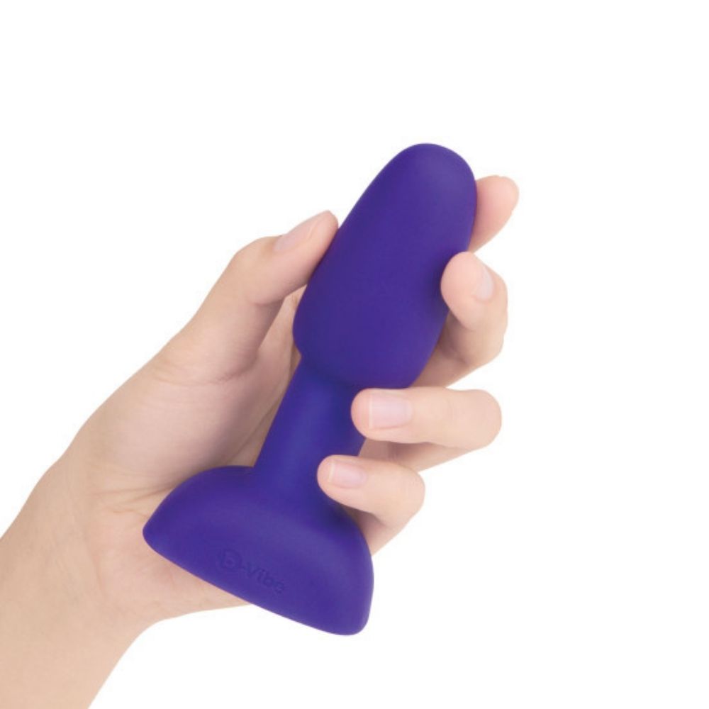 Purple B-Vibe Rimming Petite Plug held in hand