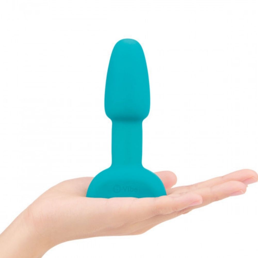 Teal B-Vibe Rimming Petite Plug  standing upright on the palm of a hand