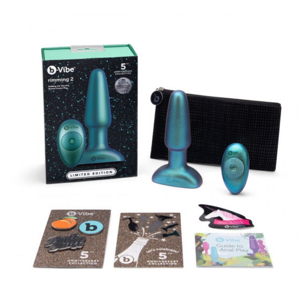The contents of the B-Vibe Rimming Plug 2 - Limited Edition Space Green box, including the plug, remote, travel bag, pins and user guide