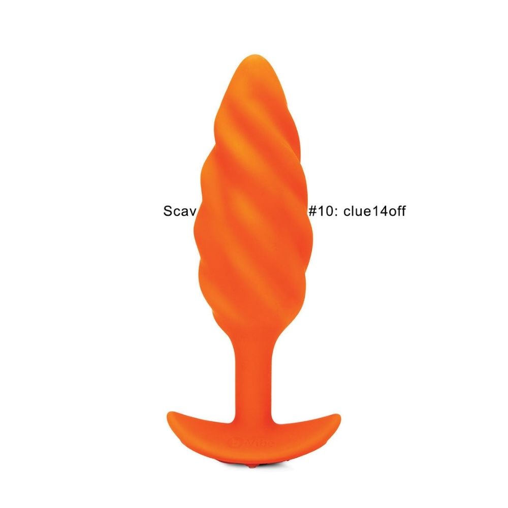 B-Vibe Texture Plug Swirl Orange (Medium) standing upright on its base