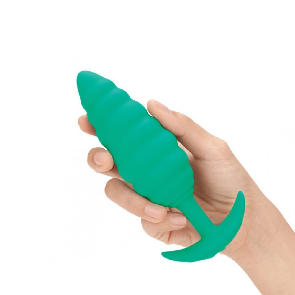 B-Vibe Texture Plug Twist Green (Large) being held in hand