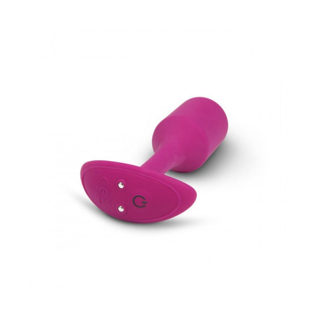 Rose B-Vibe Vibrating Snug Plug 2 (M) laying flat on its side with its base in the forefront 