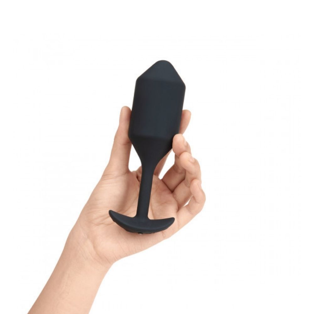 Black B-Vibe Vibrating Snug Plug 4 (XL) being held in hand