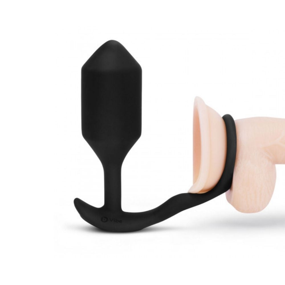 B-Vibe Vibrating Snug & Tug placed on the base of a dildo showing how it can be used