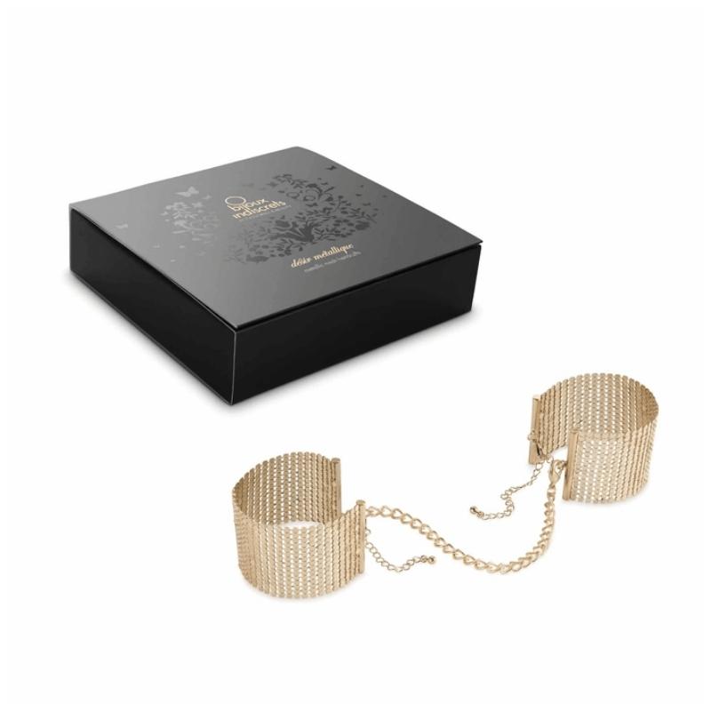 Gold Bijoux Indiscrets Desir Metallique Mesh Handcuffs beside the box they come in