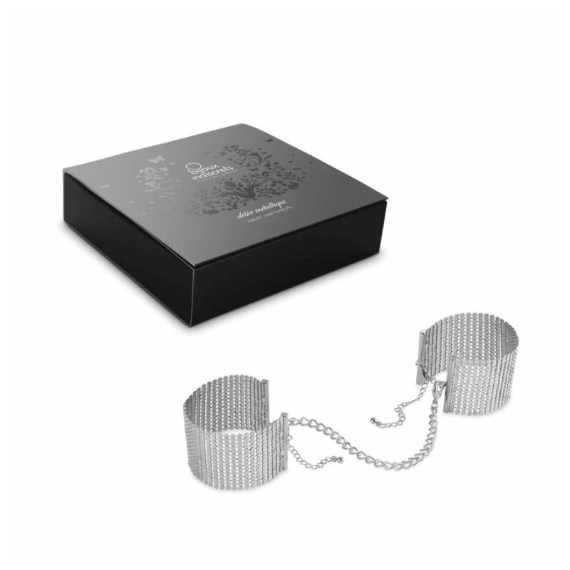 Silver Bijoux Indiscrets Desir Metallique Mesh Handcuffs beside the box they come in