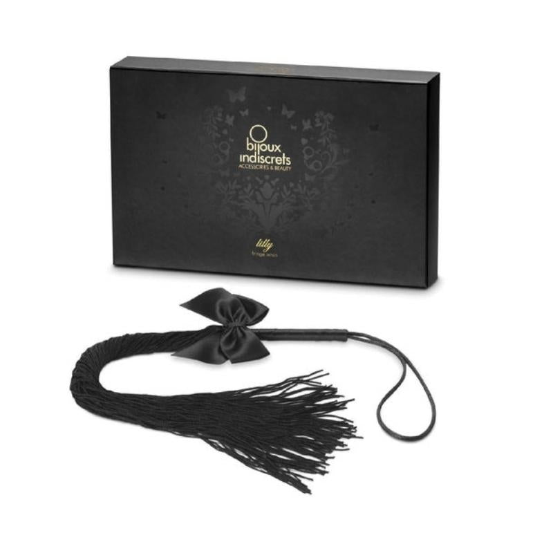 Bijoux Indiscrets Lilly Fringe Whip infront of the box it comes in