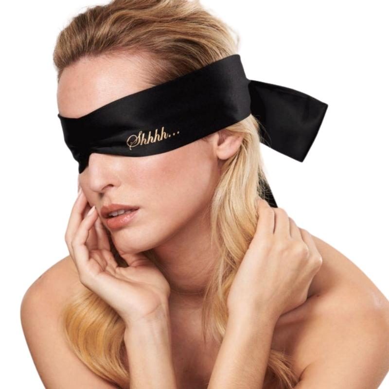 Bijoux Indiscrets Shhh Satin Blindfold on face covering the eyes