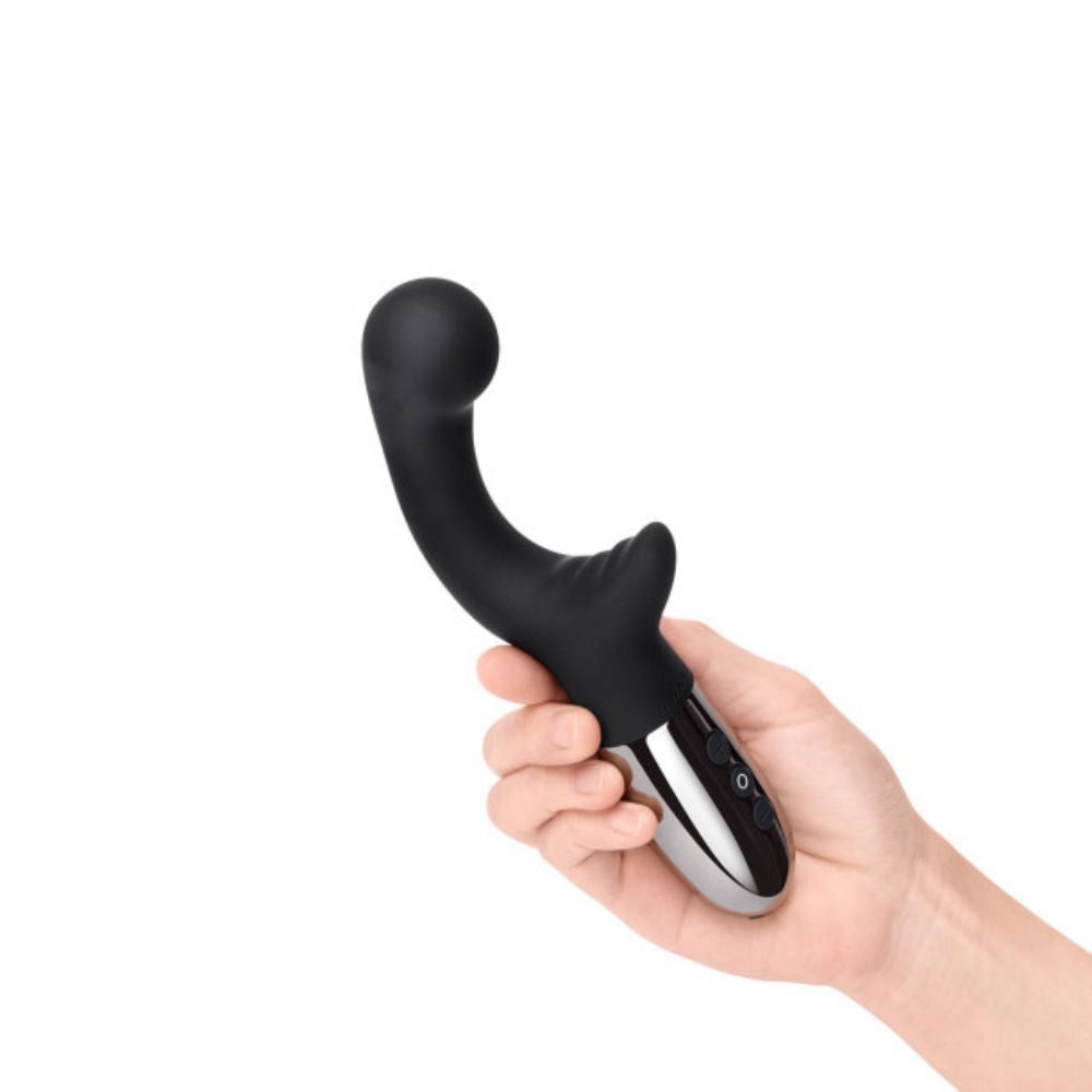 Black Le Wand Xo held in hand by the handle