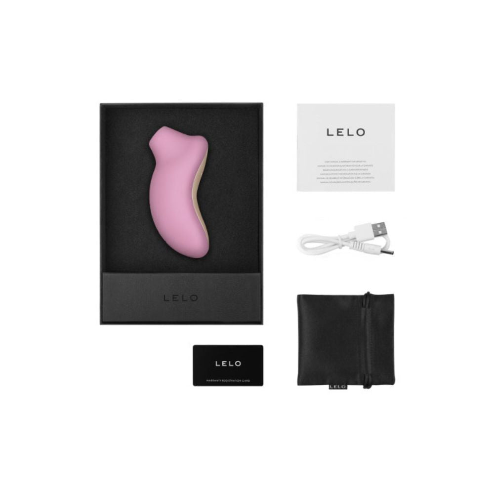 Inside the box of the Lelo Sona, showing the charging cable, storage pouch and instruction manual