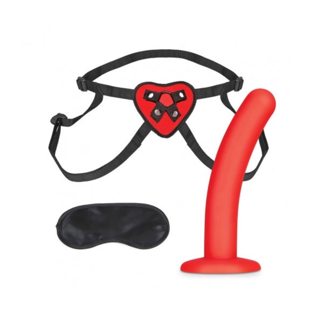 The blindfold, harness and dildo included in the Lux Fetish Red Heart Strap On 5 in. Dildo Set 