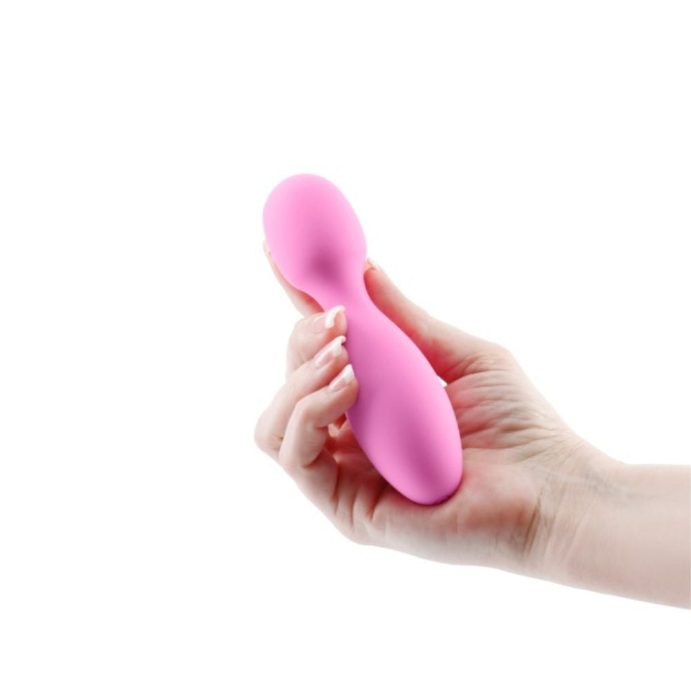 Revel Noma Mini Wand in pink, held in hand