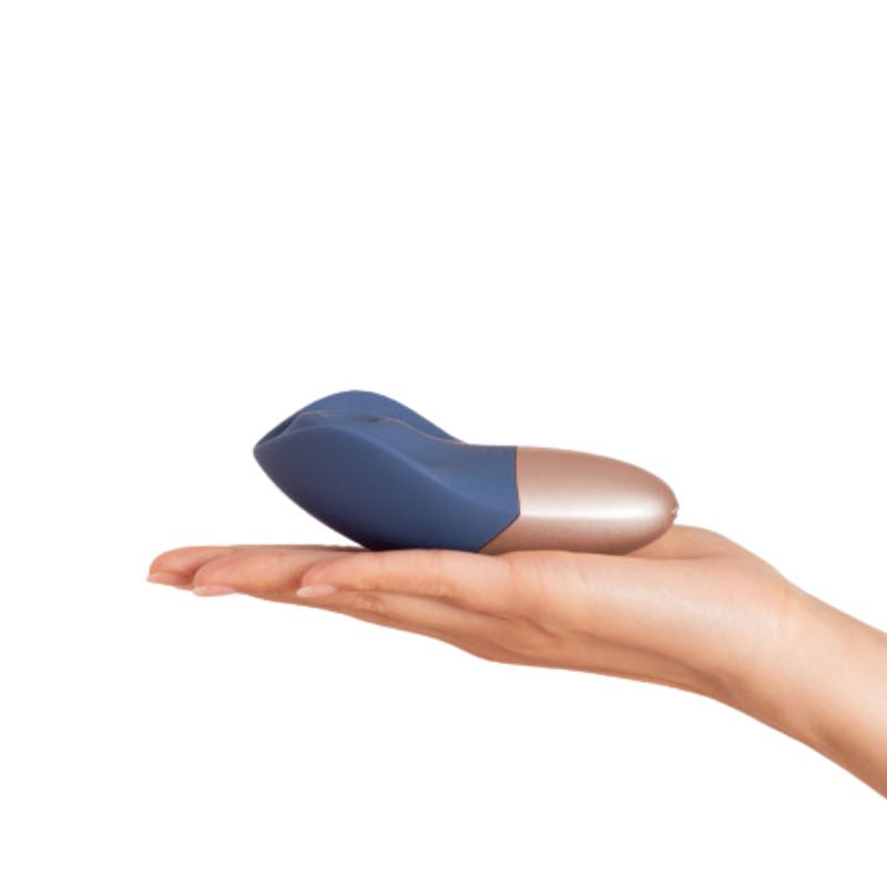 The Arouser by Deia held in the palm of a hand