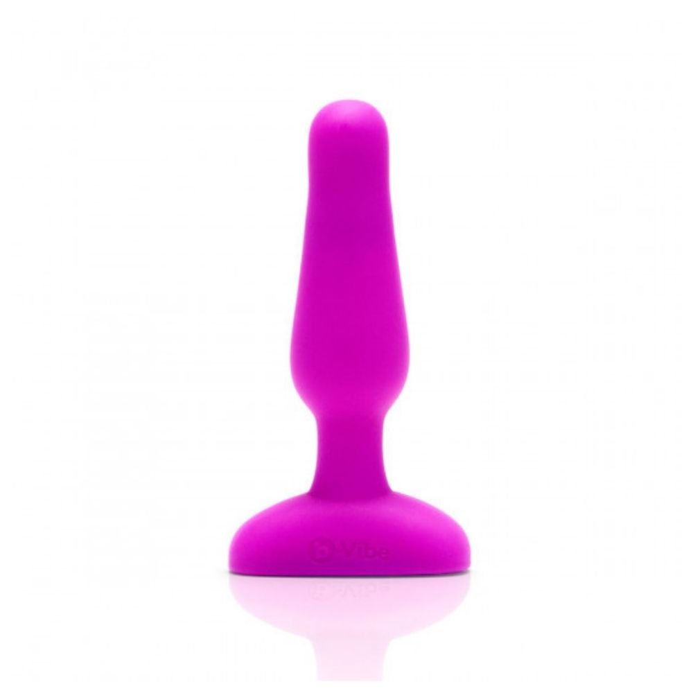 Fuchsia B-Vibe Novice Plug standing upright on base