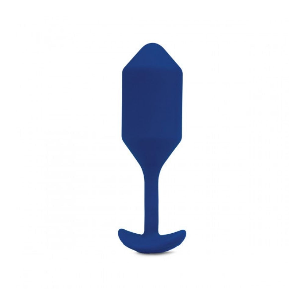 Navy B-Vibe Vibrating Snug Plug 4 (XL) standing upright on its base
