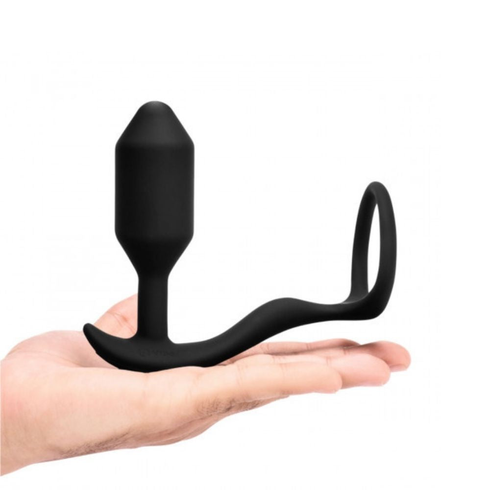 Medium B-Vibe Vibrating Snug & Tug placed on the palm of a hand