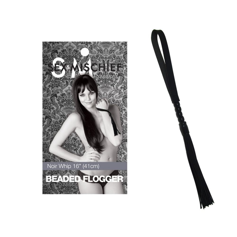Beaded Noir Flogger beside the box it comes in