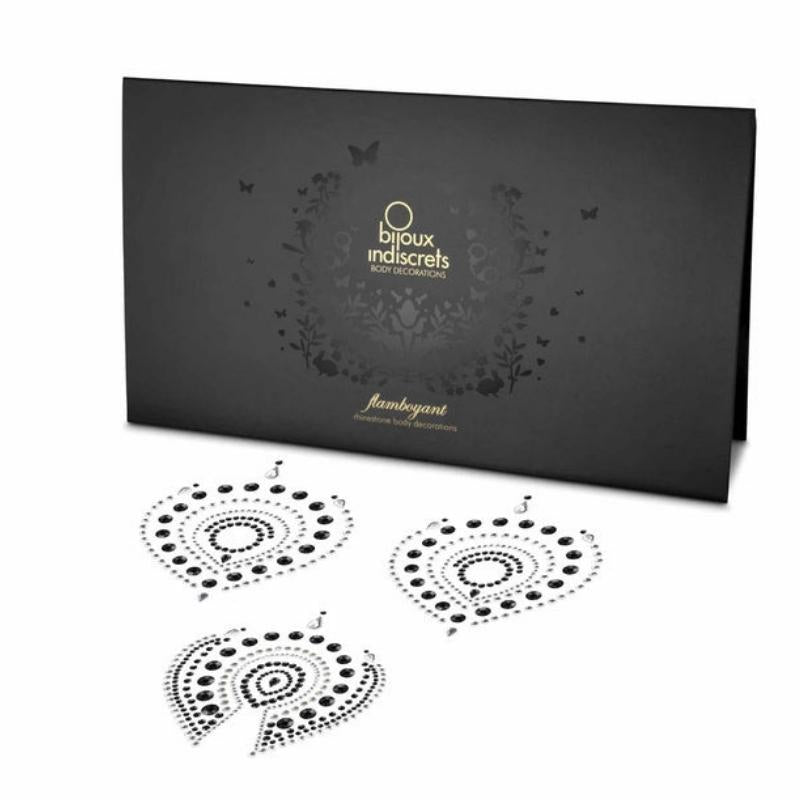 Bijoux Indiscrets Flamboyant in black and silver beside the box they come in