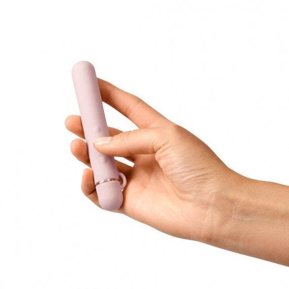 Rose gold Le Wand Chrome Baton held in hand
