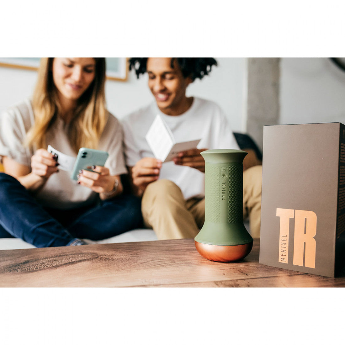 couple reading MYHIXEL TR information and MYHIXEL TR on a table  