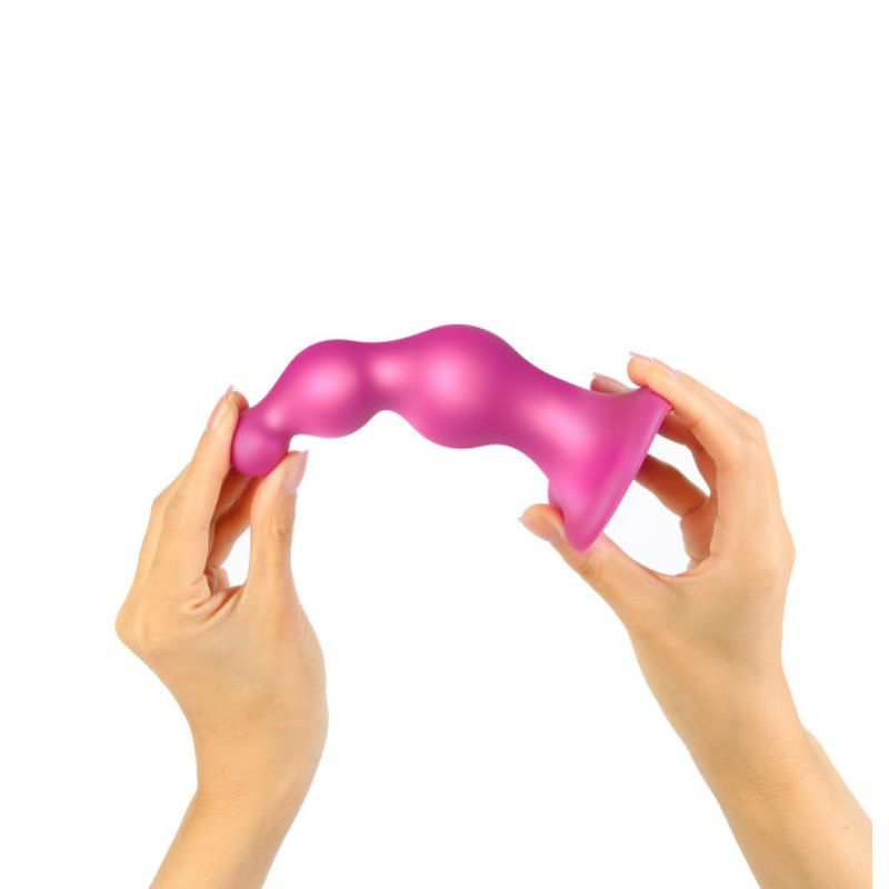 Strap-On-Me Beads being bent as its held in hands