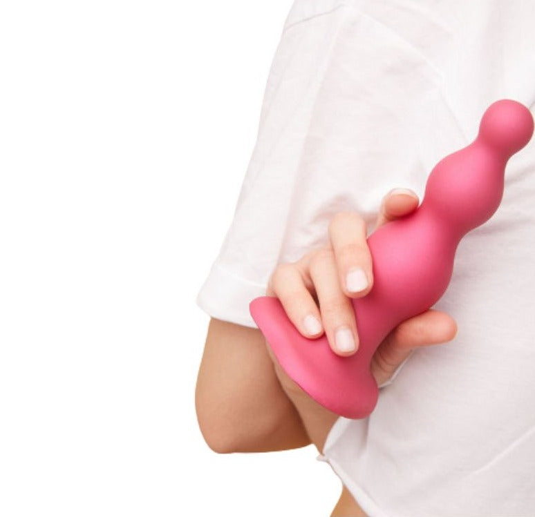Strap-On-Me Beads held in hand