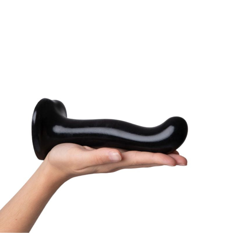Strap-On-Me P&G Spot laying flat in the palm of a hand