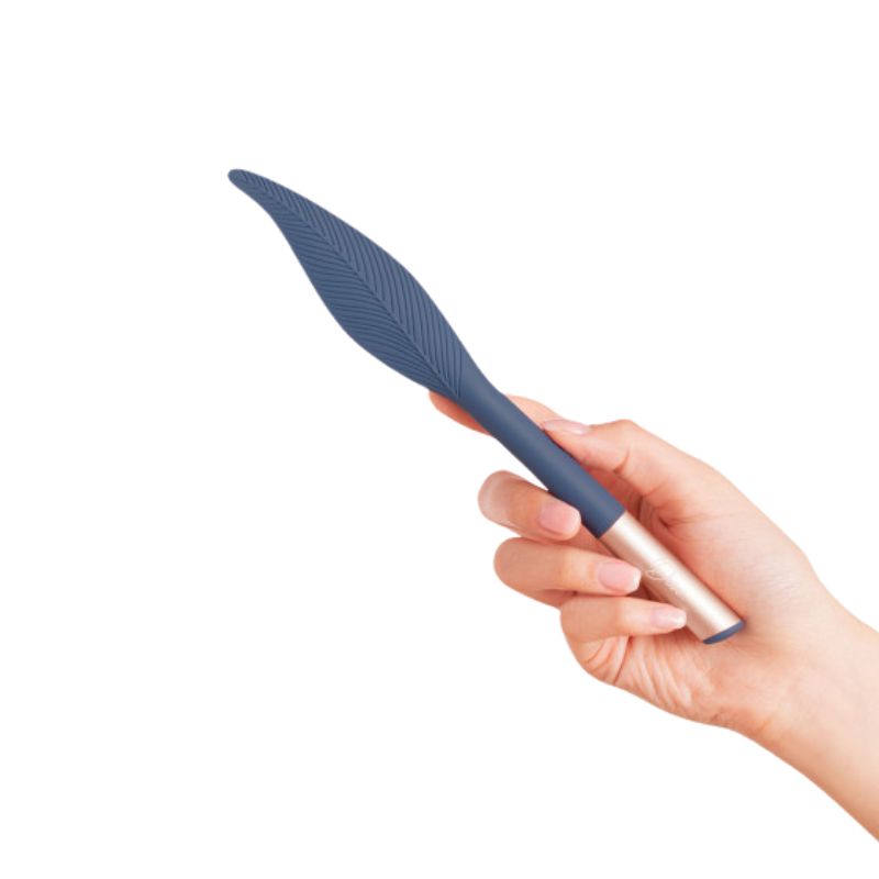 The Feather by Deia held in hand by the handle