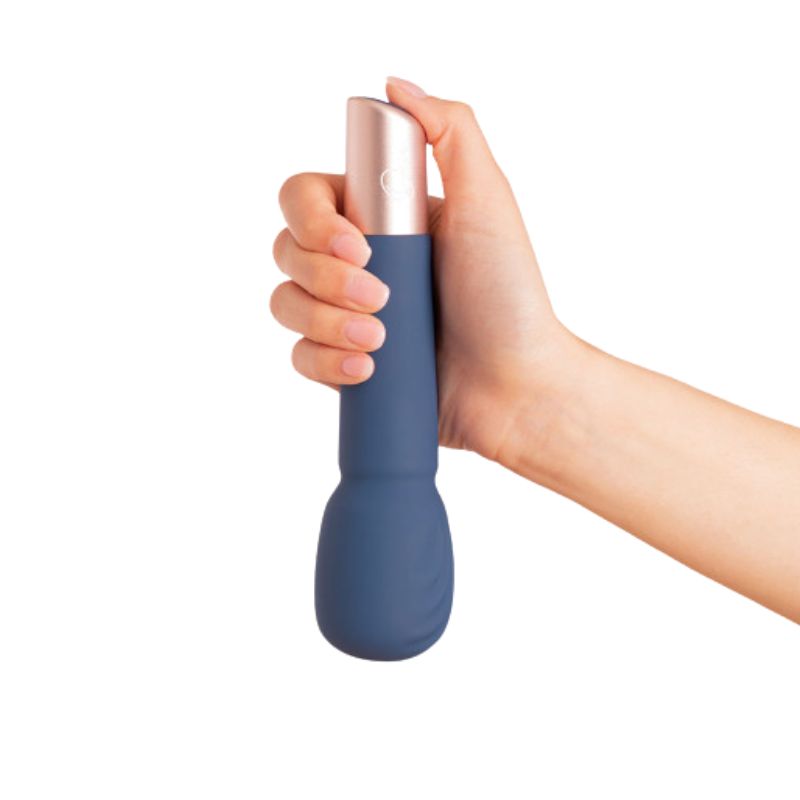 The Wand by Deia held in hand facing down